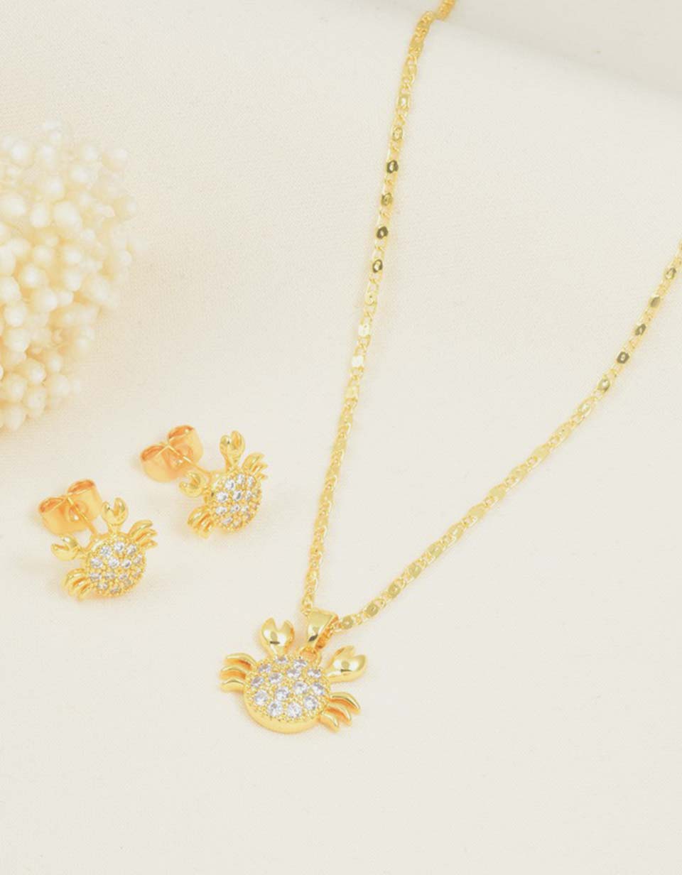 Set de cadena y aretes de cangrejo con piedras brillantes