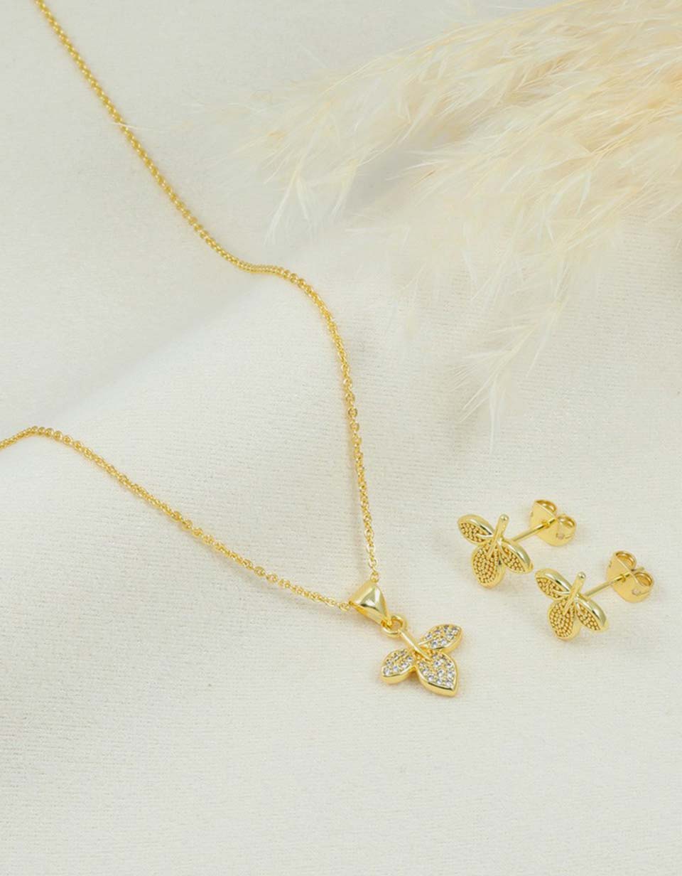 Set de cadena y aretes de hoja con piedras brillantes
