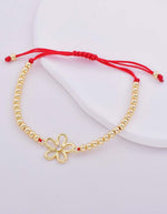 Pulsera con dije de flor y piedra brillante