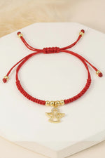 Manilla con dije de ángel en tejido rojo