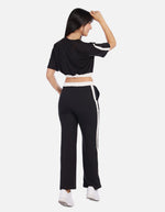 Conjunto mujer bicolor con top crop y pantalón recto