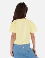 Camiseta crop para niña con estampado floral y mensaje positivo